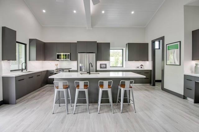 3702 Duck Ave, Key West, FL 33040 - kitchen with a sink, modern cabinets, appliances with stainless steel finishes, and light countertops