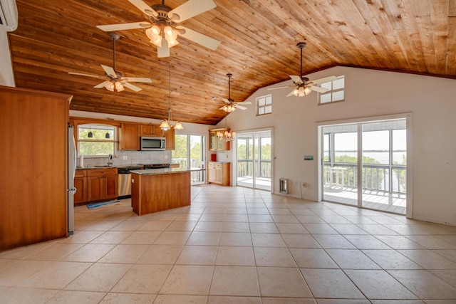 681 Indies Dr, Ramrod, FL 33042 - kitchen with appliances with stainless steel finishes, wooden ceiling, open floor plan, light tile patterned floors, and brown cabinets