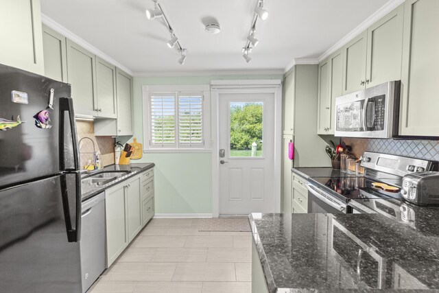 1215 97th St Unit 2, Marathon, FL 33050 - kitchen featuring appliances with stainless steel finishes, a sink, tasteful backsplash, and dark stone countertops