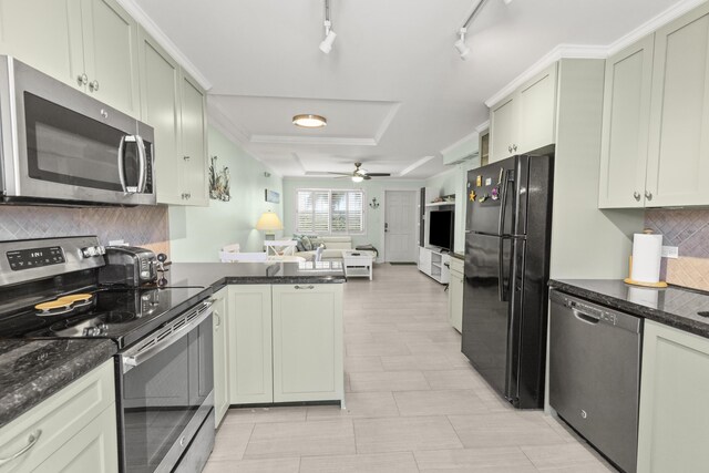 1215 97th St Unit 2, Marathon, FL 33050 - kitchen featuring stainless steel appliances, backsplash, open floor plan, a peninsula, and ceiling fan