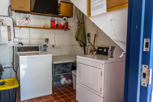 1215 97th St Unit 2, Marathon, FL 33050 - laundry room with separate washer and dryer, electric panel, dark tile patterned floors, and concrete block wall