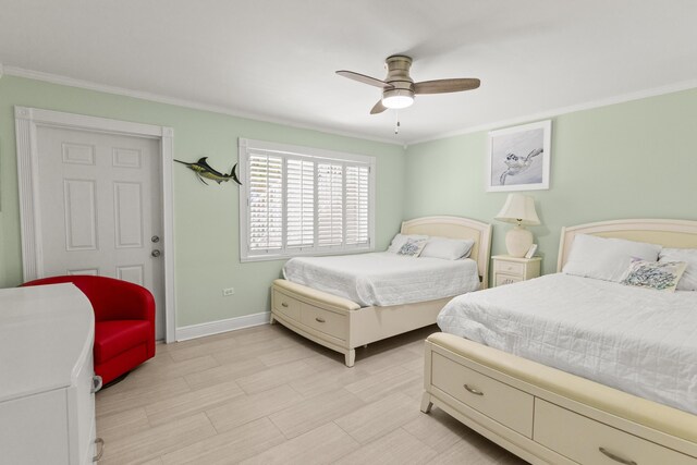 1215 97th St Unit 2, Marathon, FL 33050 - bedroom with crown molding, baseboards, a ceiling fan, and light flooring