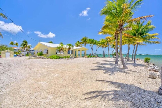 exterior space with a water view