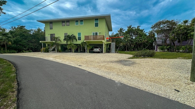 109 Stirrup Key Woods Rd Unit 1B2, Marathon, FL 33050 - view of front facade featuring a carport, driveway, and stairs
