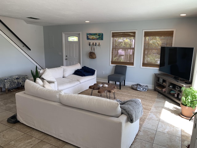109 Stirrup Key Woods Rd Unit 1B2, Marathon, FL 33050 - tiled living room featuring healthy amount of natural light, stairway, recessed lighting, and baseboards