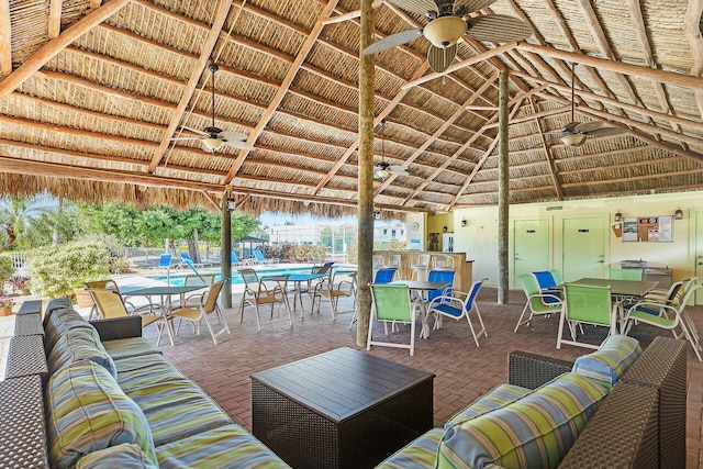 view of patio with an outdoor hangout area, a gazebo, and a ceiling fan