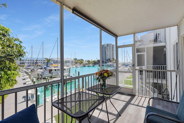 balcony featuring a water view