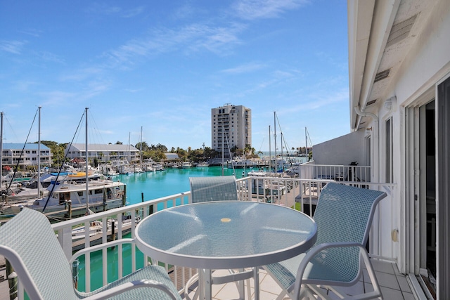 balcony featuring a water view