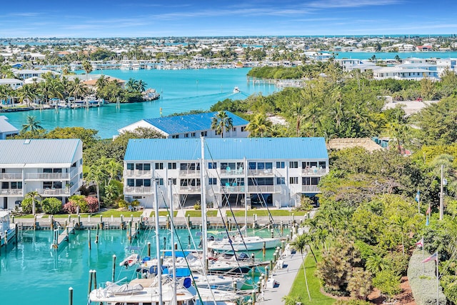 birds eye view of property with a residential view and a water view