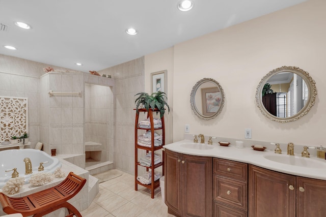 bathroom featuring double vanity, tile patterned flooring, a walk in shower, and a sink