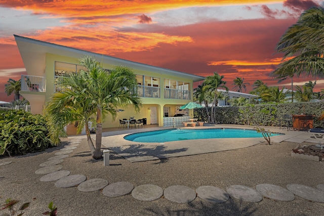 view of pool with a patio area, fence, and a fenced in pool