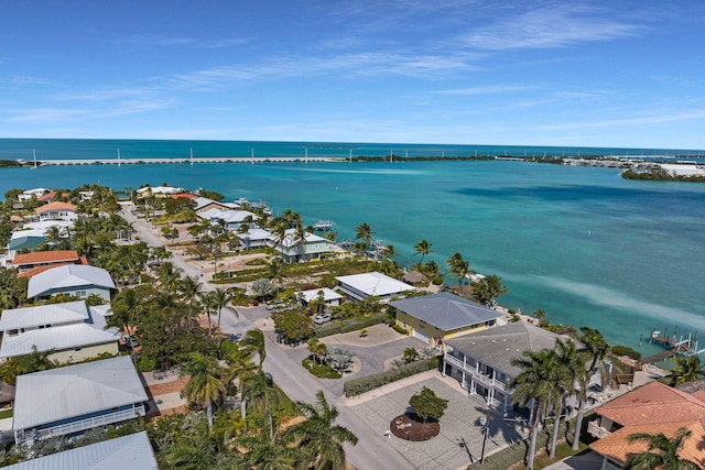 birds eye view of property with a water view and a residential view