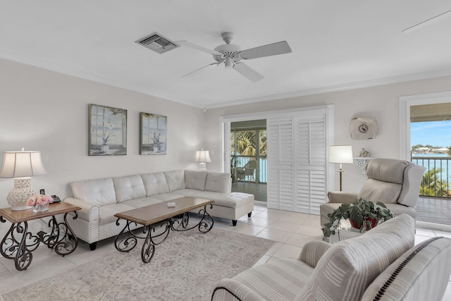 living area with ornamental molding, visible vents, ceiling fan, and light tile patterned flooring