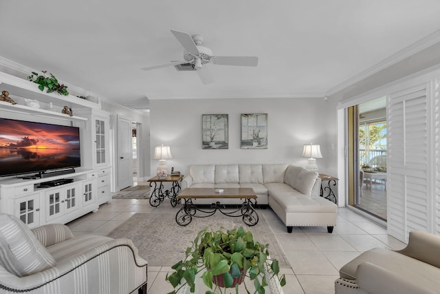 living room with ornamental molding, a ceiling fan, and light tile patterned flooring