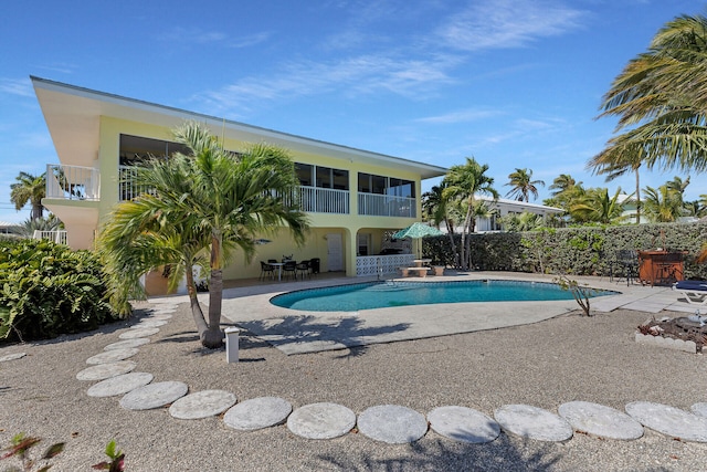 view of swimming pool featuring a patio area and a fenced in pool