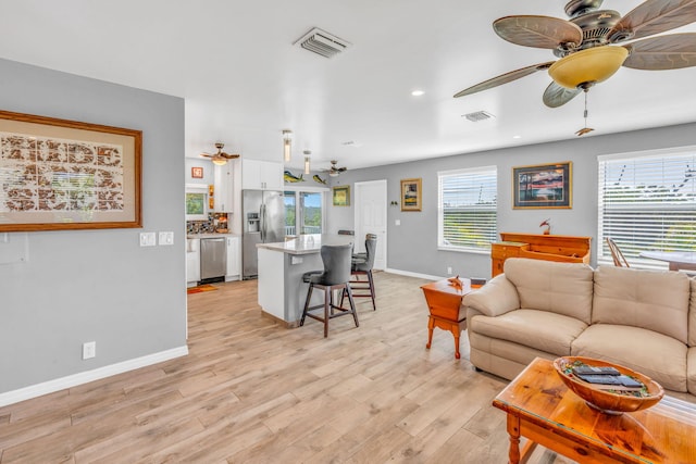 421 Ixora Dr, Big Pine, FL 33043 - living room featuring ceiling fan, light wood-style flooring, baseboards, and recessed lighting