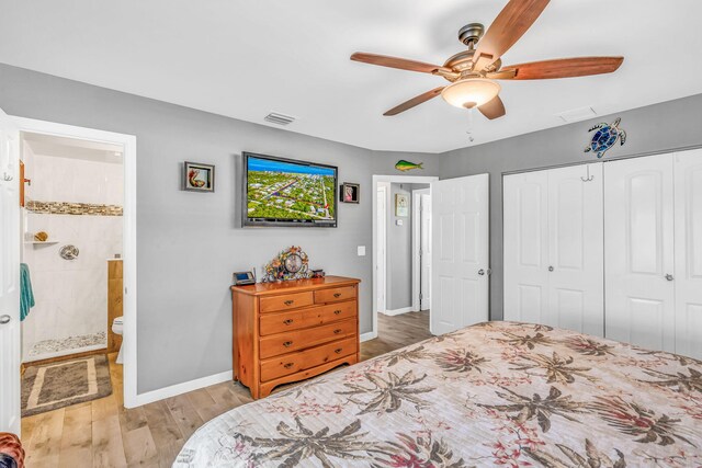 421 Ixora Dr, Big Pine, FL 33043 - bedroom featuring light wood-type flooring, baseboards, a closet, ensuite bathroom, and a ceiling fan