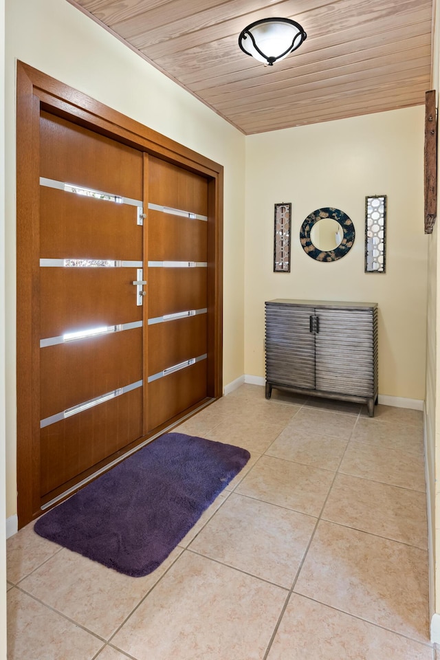 280 100th St, Ocean, Marathon, FL 33050 - tiled entryway featuring baseboards and wooden ceiling