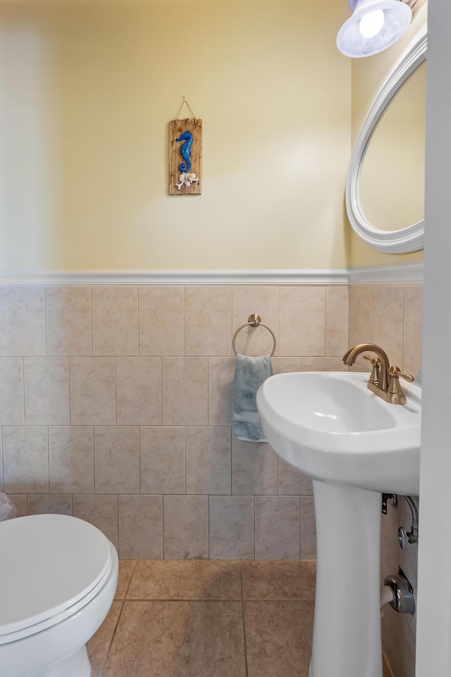 280 100th St, Ocean, Marathon, FL 33050 - half bath with toilet, tile walls, tile patterned flooring, and a wainscoted wall