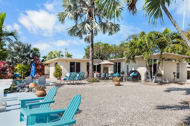 280 100th St, Ocean, Marathon, FL 33050 - back of house featuring a patio area and stucco siding