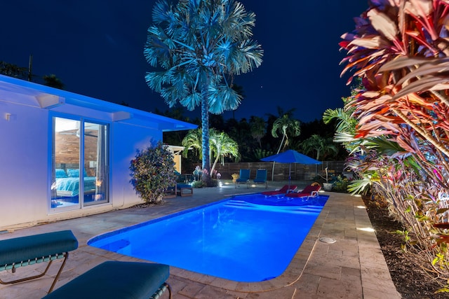 280 100th St, Ocean, Marathon, FL 33050 - pool at night with fence, a fenced in pool, and a patio area