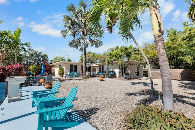 280 100th St, Ocean, Marathon, FL 33050 - rear view of property featuring a patio, fence, and stucco siding