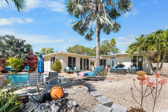 280 100th St, Ocean, Marathon, FL 33050 - back of property with a patio, an outdoor pool, and stucco siding