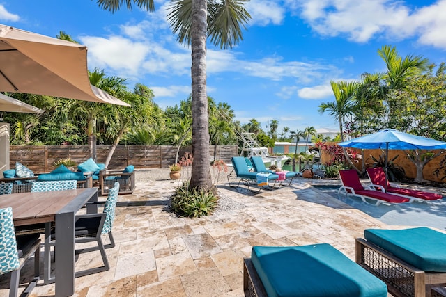 280 100th St, Ocean, Marathon, FL 33050 - view of patio / terrace featuring a fenced backyard and outdoor dining space