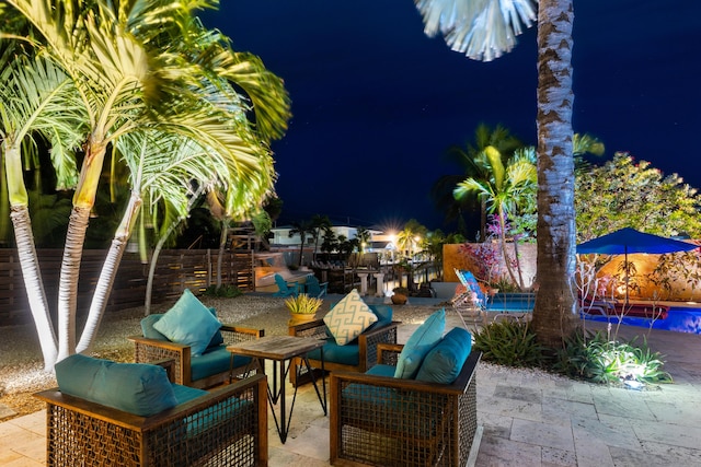 280 100th St, Ocean, Marathon, FL 33050 - patio at twilight with fence, an outdoor pool, and an outdoor hangout area