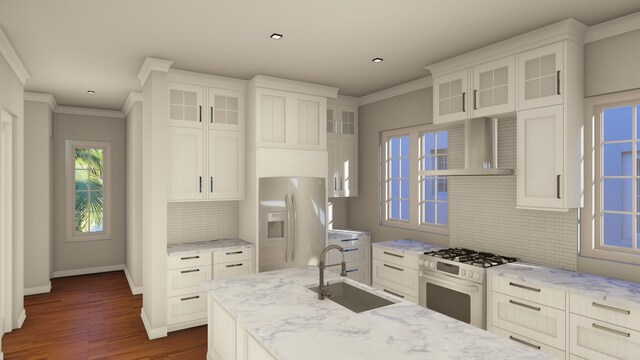 kitchen featuring gas range gas stove, stainless steel fridge with ice dispenser, ornamental molding, a sink, and wall chimney range hood