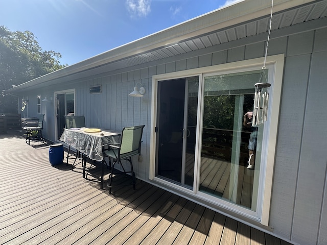 wooden deck featuring outdoor dining space