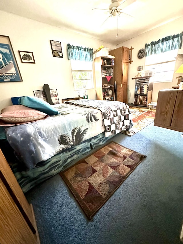 carpeted bedroom with ceiling fan