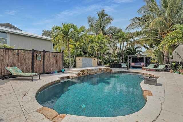 view of swimming pool featuring a fenced in pool, a patio, and fence