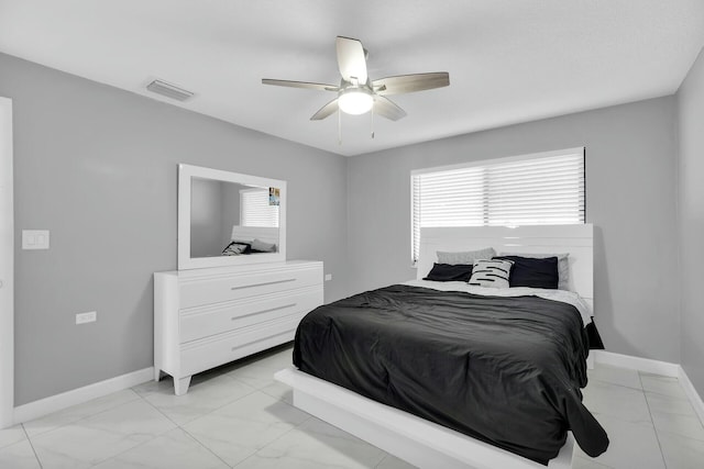 bedroom with baseboards, visible vents, marble finish floor, and ceiling fan