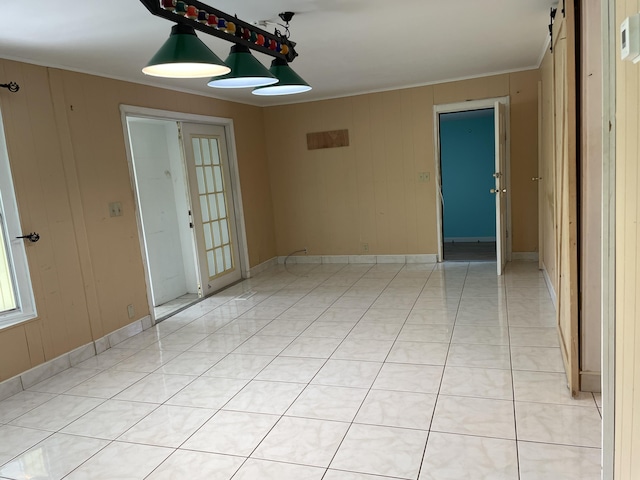 27858 Lobster Tail Trl, Little Torch, FL 33042 - unfurnished room featuring ornamental molding, wooden walls, and baseboards