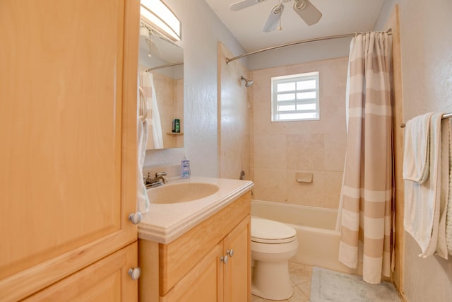 full bathroom featuring toilet, shower / bath combo, ceiling fan, vanity, and tile patterned flooring