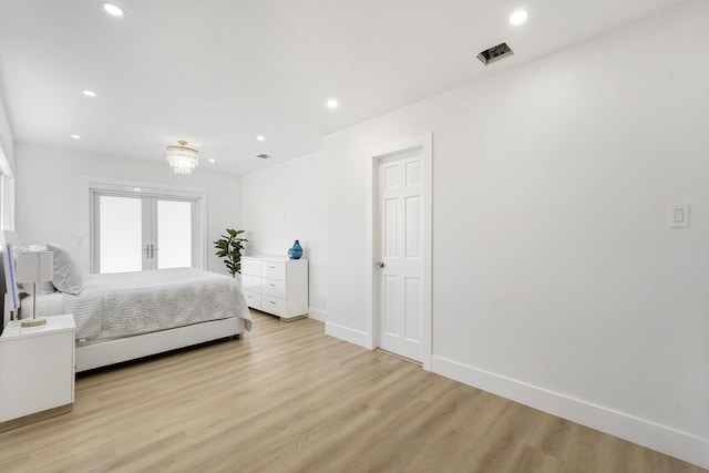 bedroom with french doors, light wood finished floors, recessed lighting, and baseboards