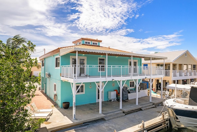 rear view of property featuring a patio