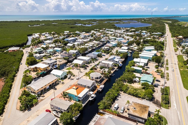 aerial view with a residential view and a water view