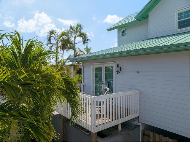 28560 Doubloon Rd, Little Torch, FL 33042 - view of home's exterior with a deck, french doors, and a metal roof