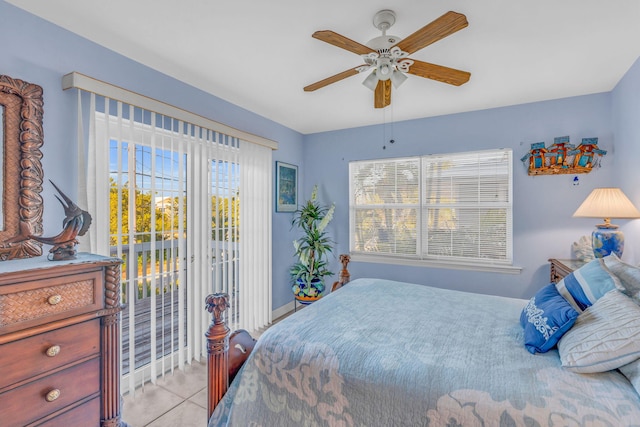 bedroom with tile patterned flooring, multiple windows, ceiling fan, and access to exterior