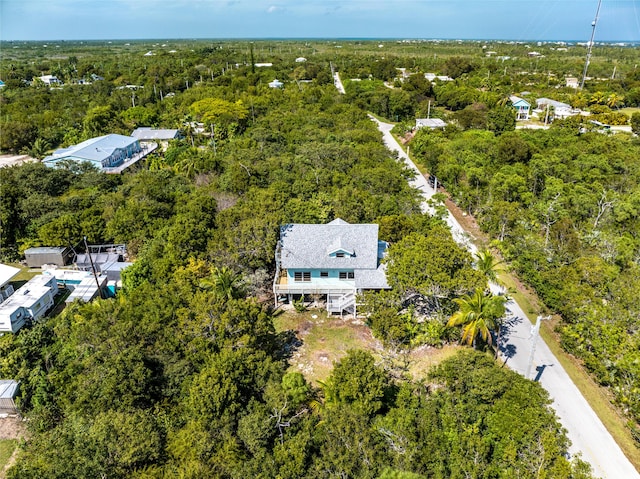 drone / aerial view featuring a forest view