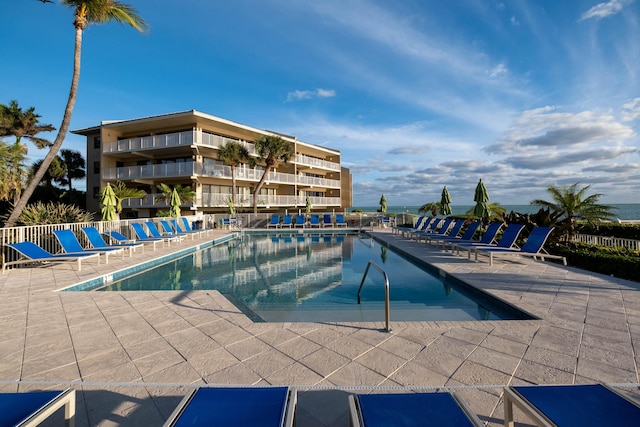 community pool with a patio area