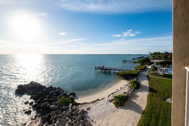 water view with a view of the beach and a boat dock