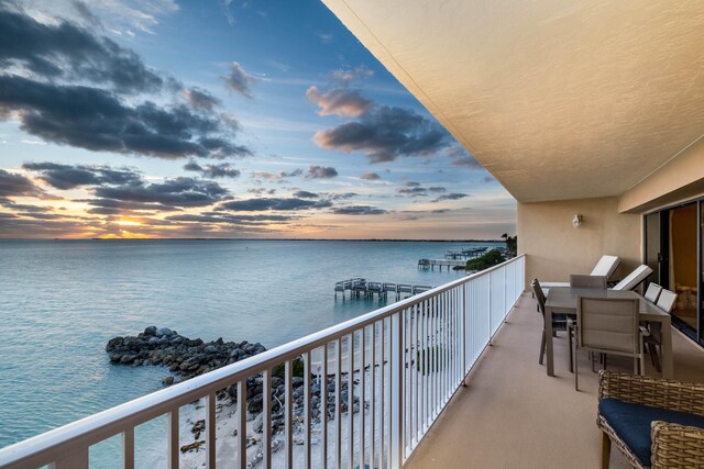 balcony at dusk with a water view