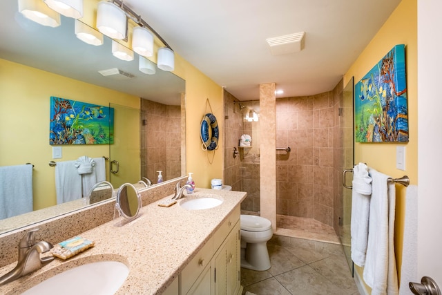 full bathroom with a shower stall, visible vents, a sink, and tile patterned floors