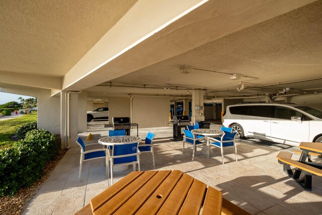 view of patio featuring a grill and outdoor dining space