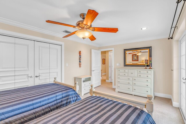 160 1st St, Key Colony, FL 33051 - bedroom with light carpet, baseboards, ornamental molding, a closet, and a ceiling fan
