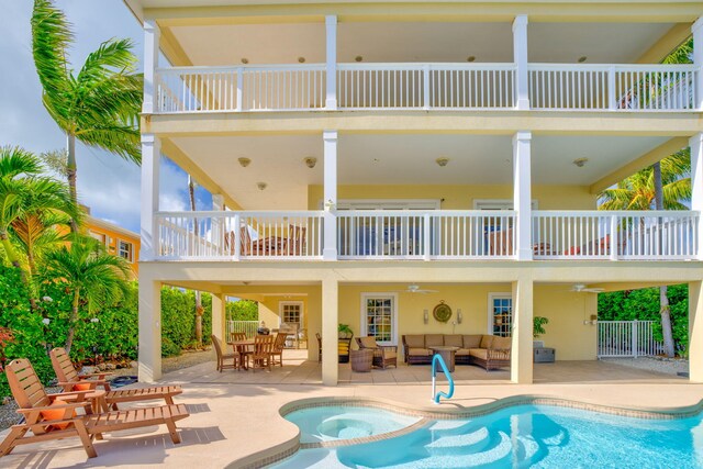 160 1st St, Key Colony, FL 33051 - rear view of property with a balcony, an outdoor hangout area, and a patio