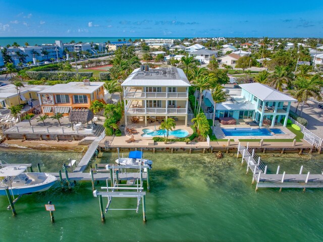 160 1st St, Key Colony, FL 33051 - aerial perspective of suburban area featuring a large body of water and a pool